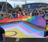 Pride-goers carry a giant Pride flag in Katowice, Poland