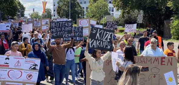 A crowd of people protest in Germany