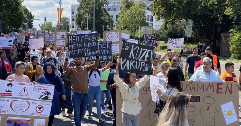 A crowd of people protest in Germany