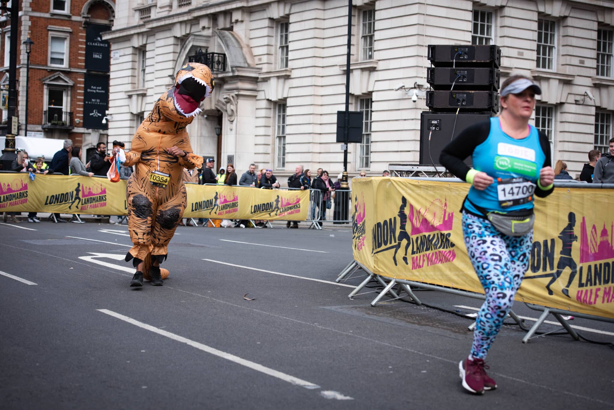 A runner dressed as a dinosaur approaches the finish line during the London Landmarks Half Marathon through Westminster and the City