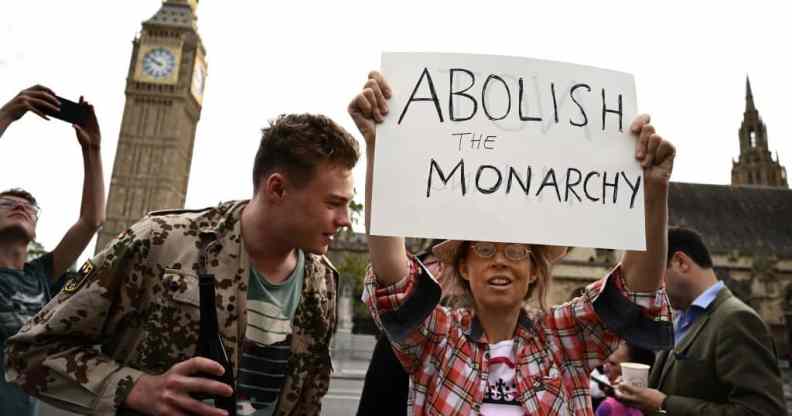 An anti-Royal demonstrator protests outside Palace of Westminster, central London on September 12, 2022.