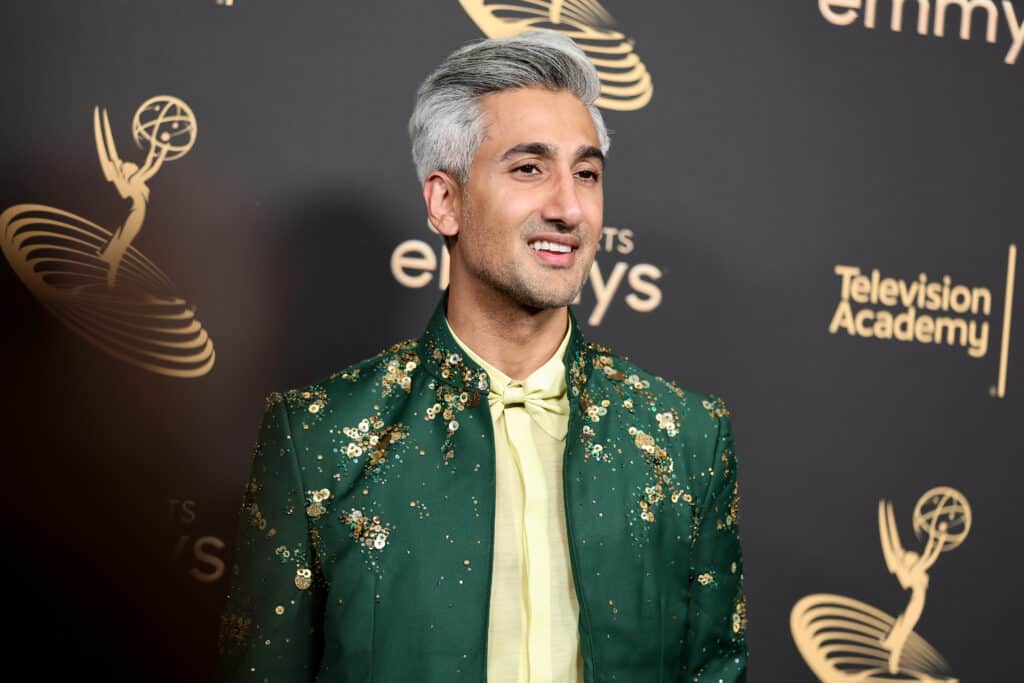 Tan France hit with abuse for feeding his child