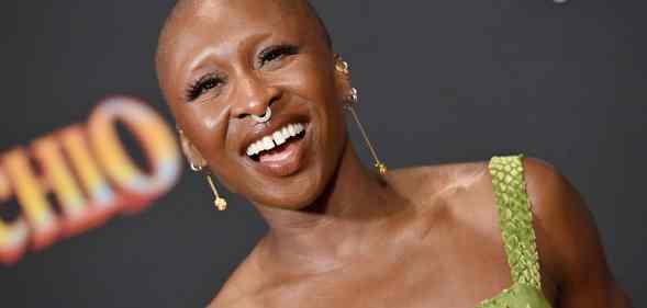 Cynthia Erivo smiling in green dress