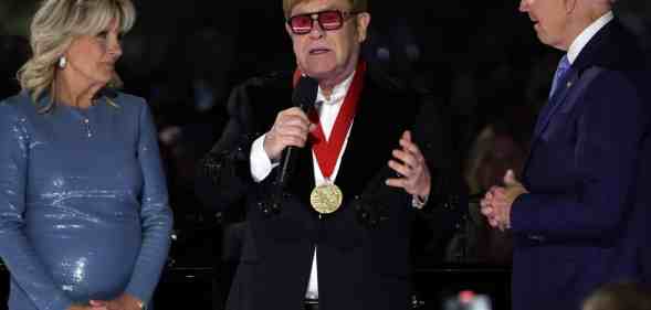 Elton John in tears as President Biden surprises him with medal at White House