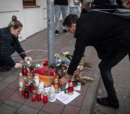 A memorial has been created on the pavement at Zamocka Street in Bratislava, Slovakia after a 'radicalised teen' shot dead two men at Tepláreň