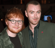 Ed Sheeran and Sam Smith smile and stand next to each other