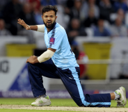 Azeem Rafiq wears a blue uniform as he plays cricket for Yorkshire