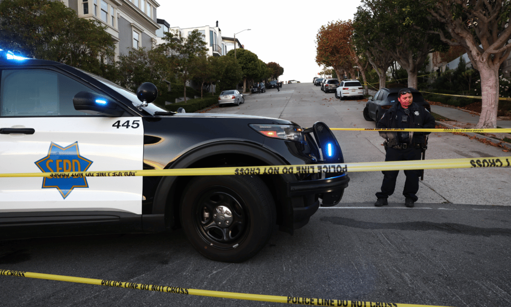 A San Francisco police officer stands guard in front of the home of US speaker of the House Nancy Pelosi