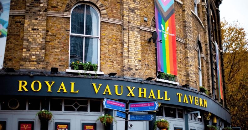 The exterior of Royal Vauxhall Tavern with an LGBTQ+ Progressive Pride flag hanging down one side of the venue