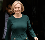 Liz Truss wears a dark green outfit as she exits 10 Downing Street