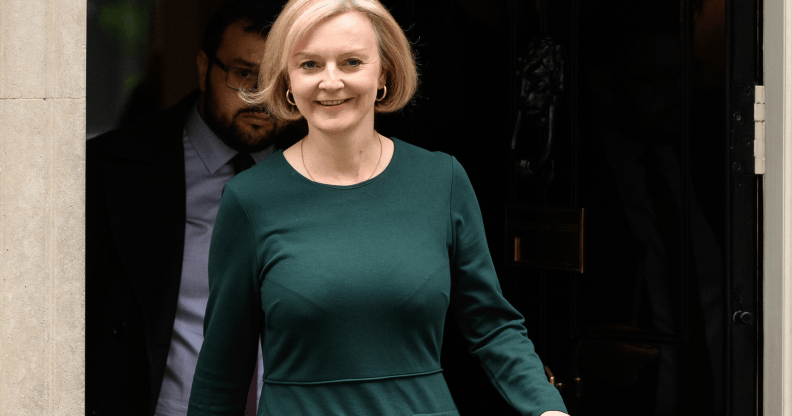 Liz Truss wears a dark green outfit as she exits 10 Downing Street