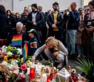 Mourners place candles and flowers at a makeshift memorial in downtown Bratislava.