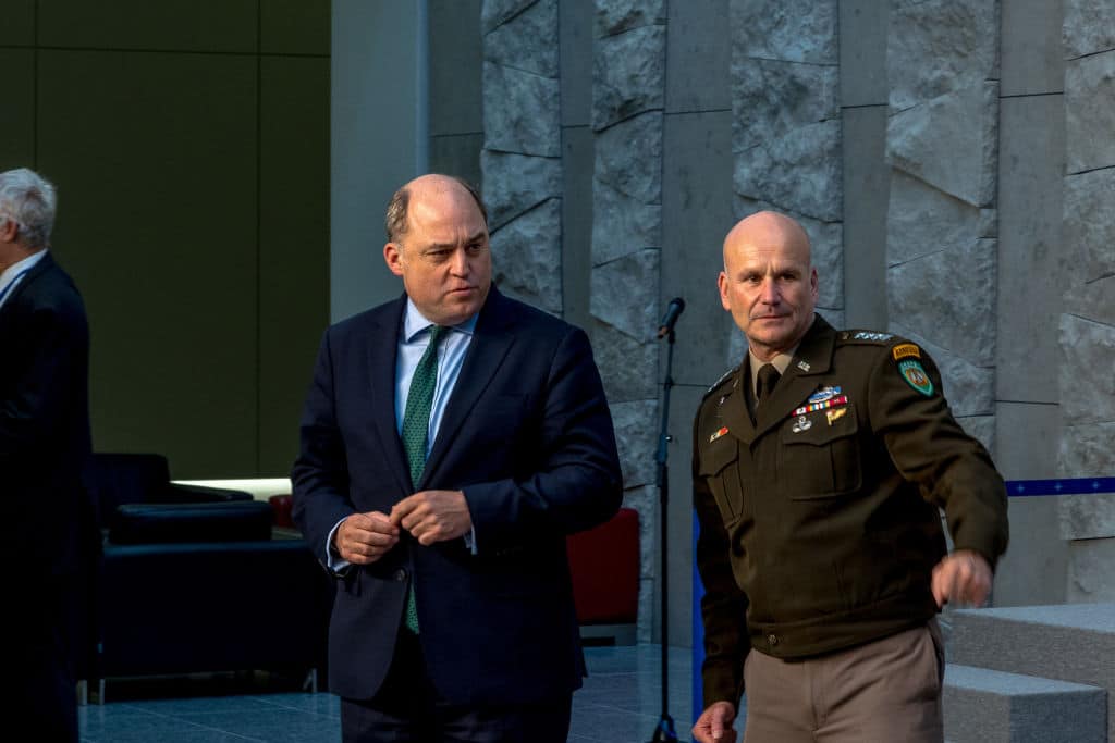 Ben Wallace speaks to delegates before posing for the official press photo on the second and final day of the NATO defence ministers' meeting.