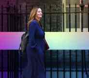 Gillian Keegan pictured walking outdoors wearing a suit.