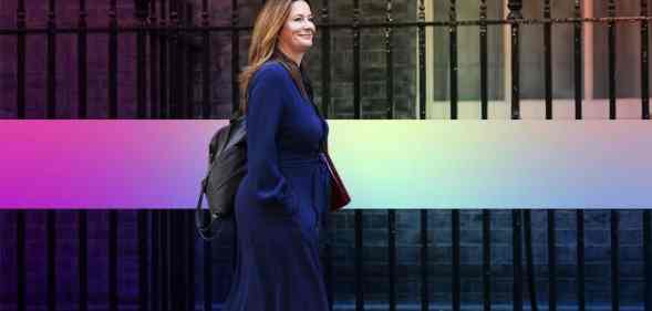 Gillian Keegan pictured walking outdoors wearing a suit.