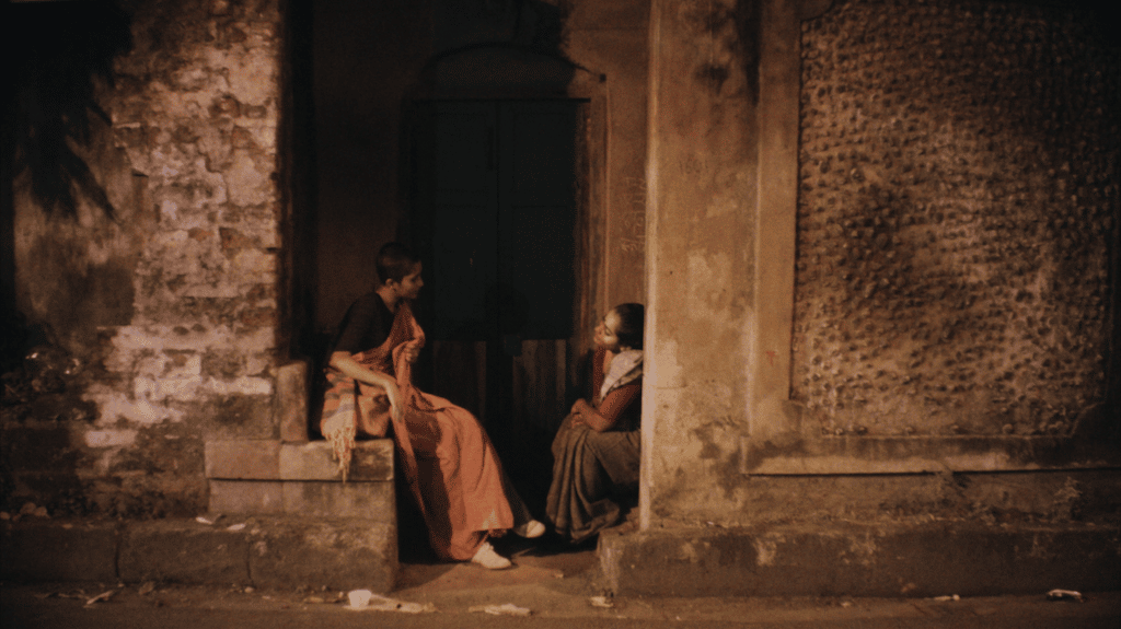 Madhu (L) looks at Satakshi (R) in Honey.