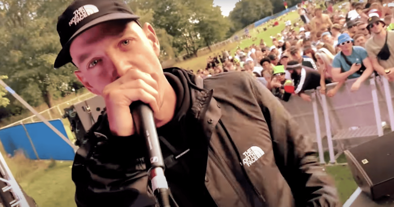 A screenshot of Welsh rapper Mr Traumatik performing at a festival