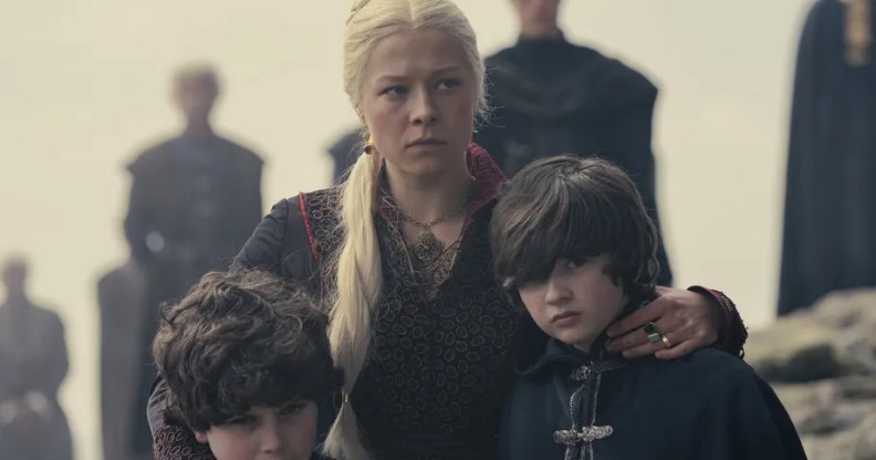 Rhaenyra holding her two young sons