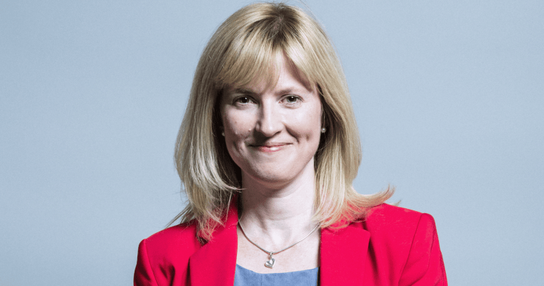 A photo of MP Rosie Duffield wearing a red suit jacket over a grey top