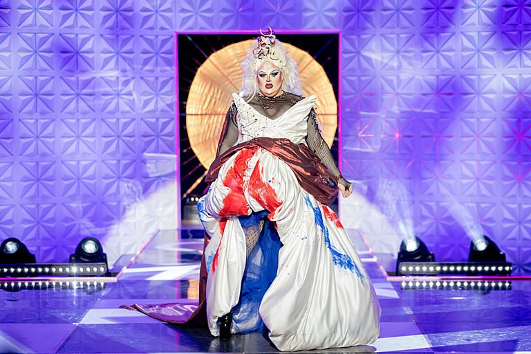 Drag Queen Pixie Polite posing on a runway