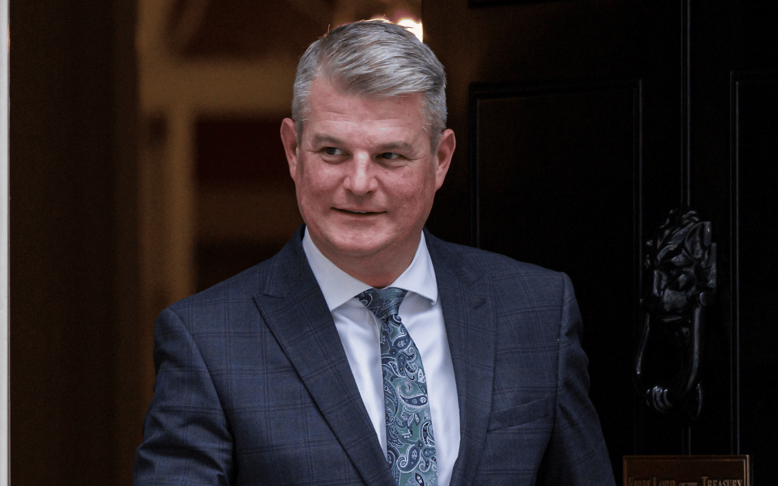 An image of sports minister Stuart Andrew as he leaves Number 10 Downing Street