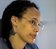 US basketball player Brittney Griner stands in a defendants' cage before a court hearing during her trial on charges of drug smuggling in Russia