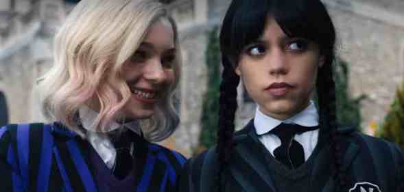 A still from new Netflix series Wednesday shows actors Emma Myers and Jenna Ortega as characters as Enid Sinclair and Wednesday Addams dressed in their school uniform costumes Enid Sinclair (L) and Wednesday (R). (Netflix)