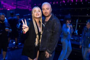 Sam Smith stands with Kim Petras