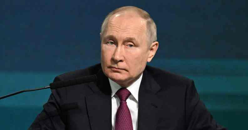 An image of Russian president Vladimir Putin during a conference.