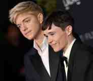 A photo of comedian Mae Martin and actor Elliot Page wearing tuxedos to a film event in LA