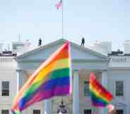 Pride flags are waved in front of the White House.