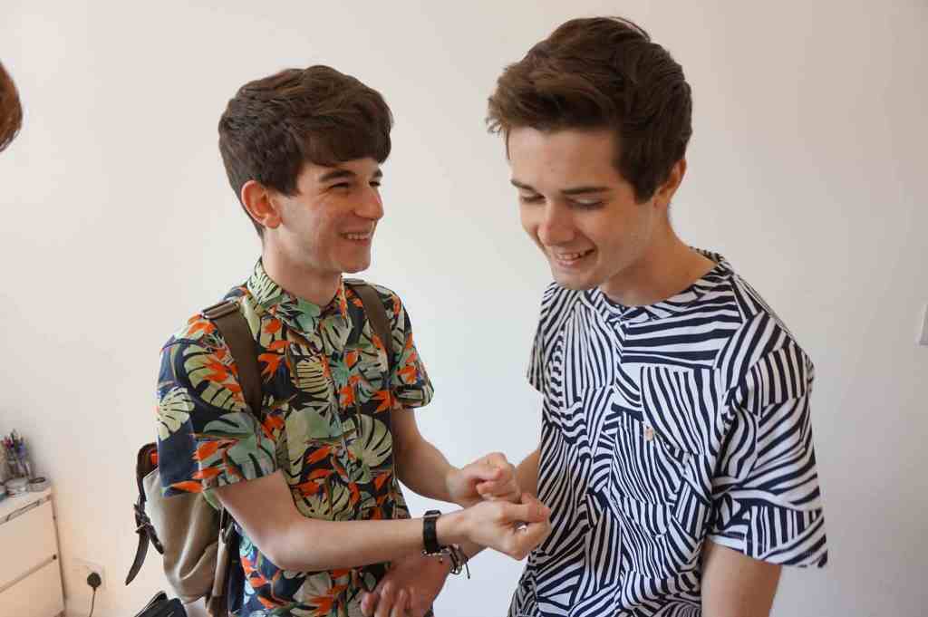 Adam Packer (L) and his late boyfriend Dean Eastmond seen both smiling