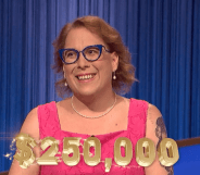 Amy Schneider wearing a pink top winning $250,000 on Jeopardy! Tournament of Champions
