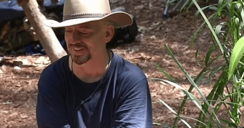 Boy George sat in a clearing in the I'm A Celeb jungle