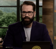 A screenshot of right-wing columnist and blogger Matt Walsh wearing glasses, black suit jacket over a white T-shirt talking on his YouTube show