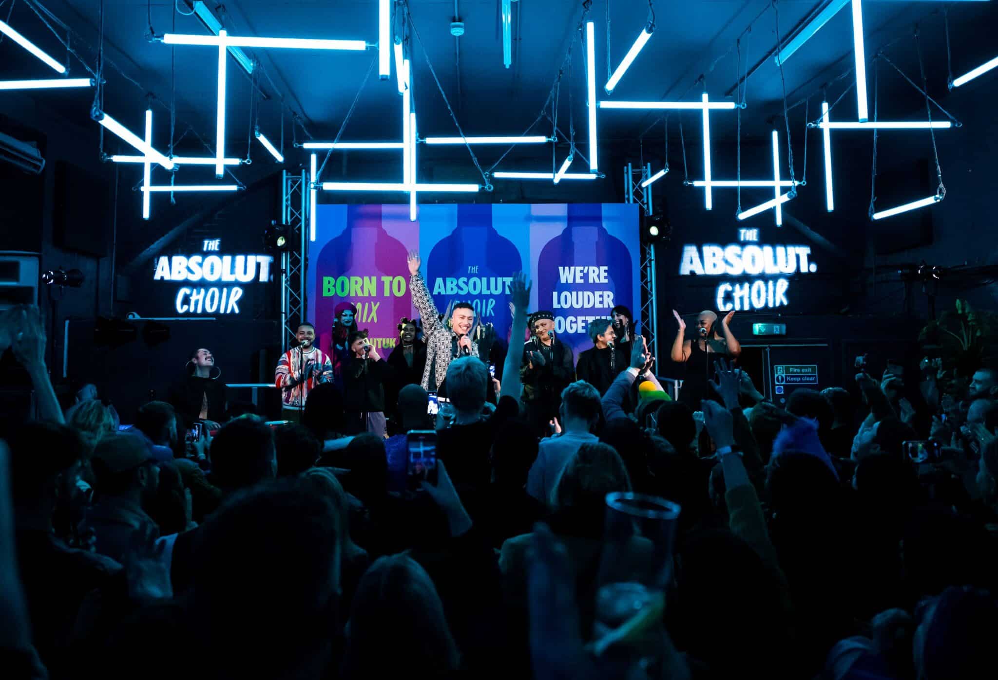 The crowd cheers Trans Voices and the Absolut Choir on during their performance. 