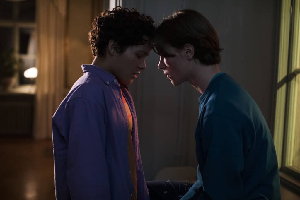 Simon (L) and Wilhelm (R) kiss for the first time in Young Royals. (Netflix)