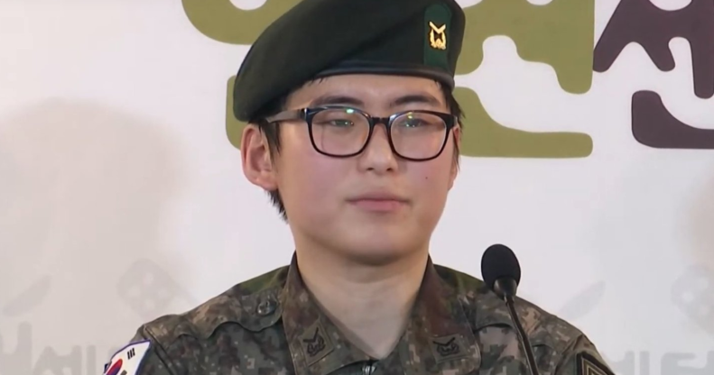 Byun Hee-soo sits wearing a traditional South Korean military uniform while at a press conference.