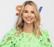 A photo of model and TV presenter Vogue Williams wearing a green top as she poses for a photo at a Sky TV event