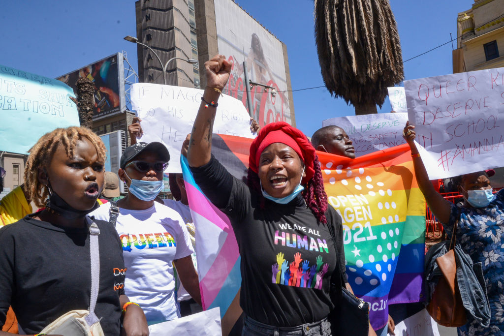 Demonstrators hold placards and chant slogans during a protest in Nairobi.