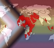 This image shows a map of the world, with countries and territories where LGBTQ+ people are criminalised are marked in red. The map is laid over the Progress Pride flag, which incorporates intersex identities, Black people and people of colour, and the entire LGBTQ+ community.