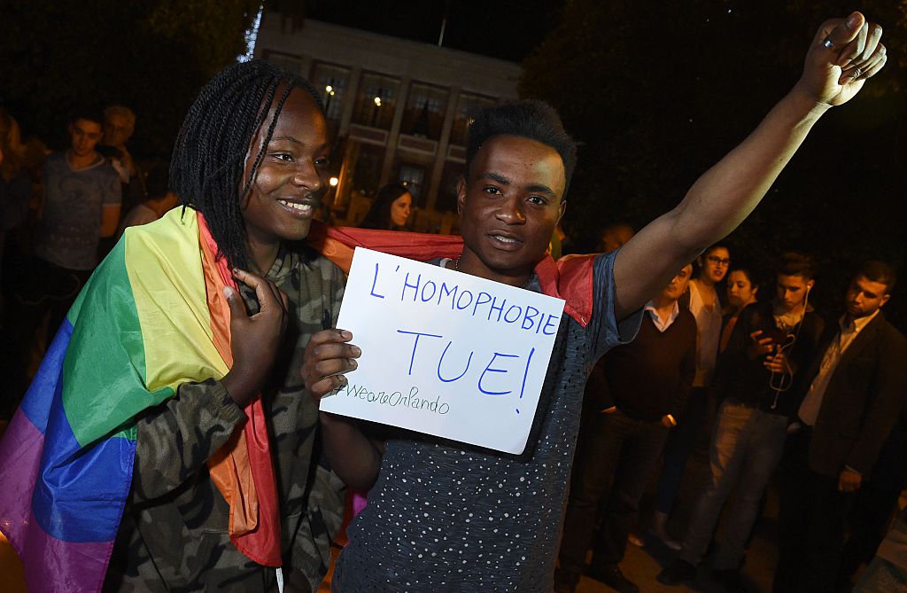 Moroccan activists participate in a vigil in Rabat on June 15, 2016, to pay tribute to the victims of the Orlando gay nightclub shooting