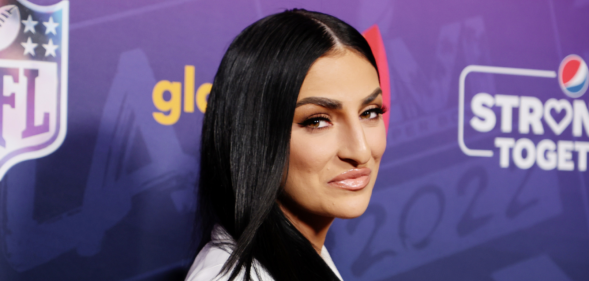 Sonya DeVille wearing a white suit at the A Night Of Pride With GLAAD And NFL.