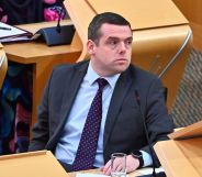 Douglas Ross sitting in parliament