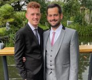 Ricardo and Bradleigh, a gay couple, wear suits and smile at the camera in an image shared as part of their promotion of fostering as a way to expand a family