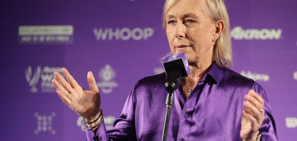 Martina Navratilova, wearing a purple top, speaks during a conference at the WTA finals.