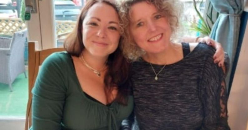 A photo shows married couple Rachael and Helen Patching sitting next to each other.