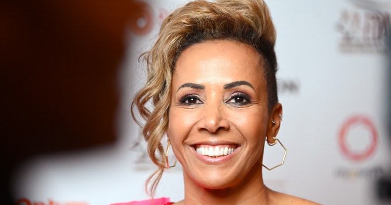 A close-up photo of athlete Dame Kelly Holmes wearing a pink dress as she attends the European Diversity Awards