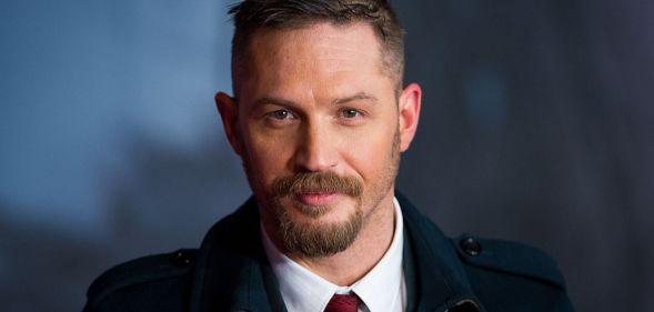 Tom Hardy has been spotted wearing rainbow Pride Crocs and the internet is obsessed.