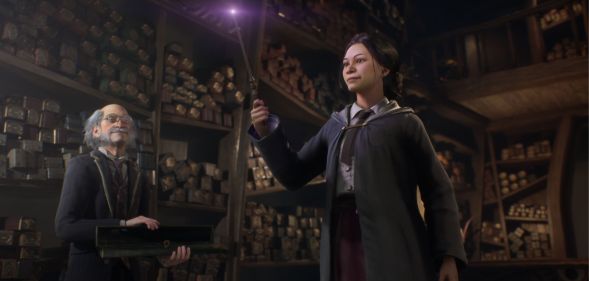 A student raises a wand in a Hogwarts wand shop.